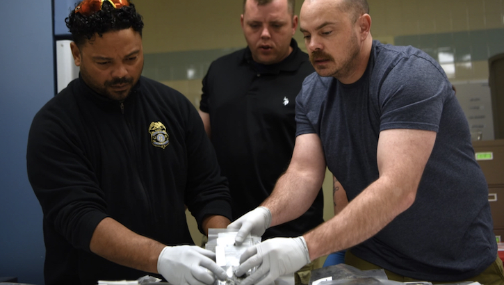 Mr. Carlos Colon, left, U.S. Army Sgt. First Class Earnie Williams, center, and U.S. Air Force Maj. Anthony Vinson, right, catalogue remains found during Operation Colony Glacier, June 23, 2023, at Joint Base Elmendorf-Richardson, Alaska.  (U.S. Air Force photo by Staff Sgt. Deven Schultz)