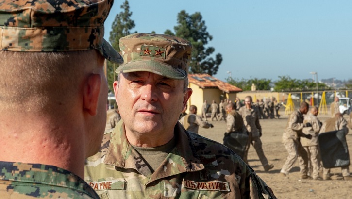 Image of Gen. Payne speaking with a soldier