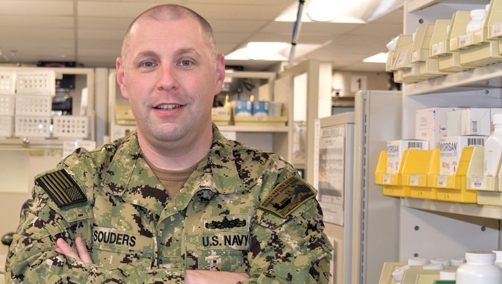 Image of Navy personnel in a pharmacy. Click to open a larger version of the image.
