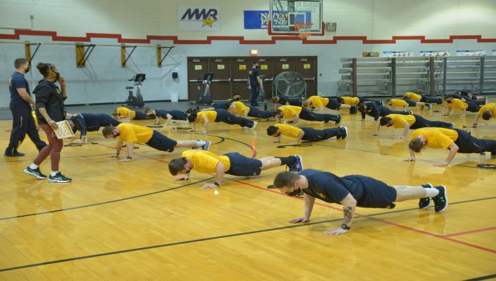 Image of Photo of group doing pushups. Click to open a larger version of the image.