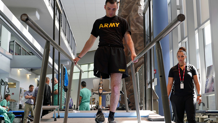 Image of Soldier walking with prosthetic leg.