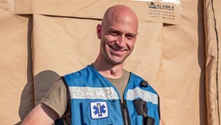 U.S. Air Force Capt. Spencer Carrier, 86th Operational Medical Readiness Squadron physical therapist, stands in Pod one at Ramstein Air Base, Germany, Sep. 4, 2021. Carrier spends his time outside of work with his church to prepare food for evacuees and their families and also collects donations to pay for clothes, diapers and toys to donate to evacuees in support of Operation Allies Refuge. (U.S. Air Force photo by Airman Jared Lovett)