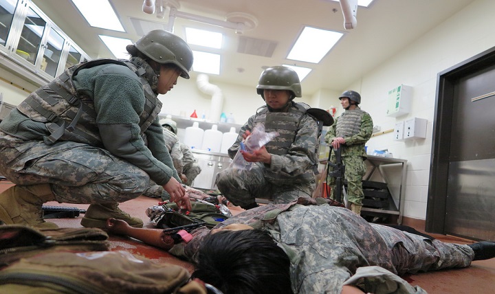 Third-year medical students at the Uniformed Services University of the Health Sciences go through an exercise on the school's campus in Bethesda, Maryland. 