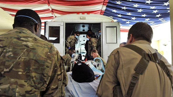 Airmen work with members of the Extracorporeal Membrane Oxygenation team to save the life of a NATO troop at the Craig Joint-Theater Hospital on Bagram Airfield, Afghanistan. (U.S. Air Force photo by Tech. Sgt. Nicholas Rau)