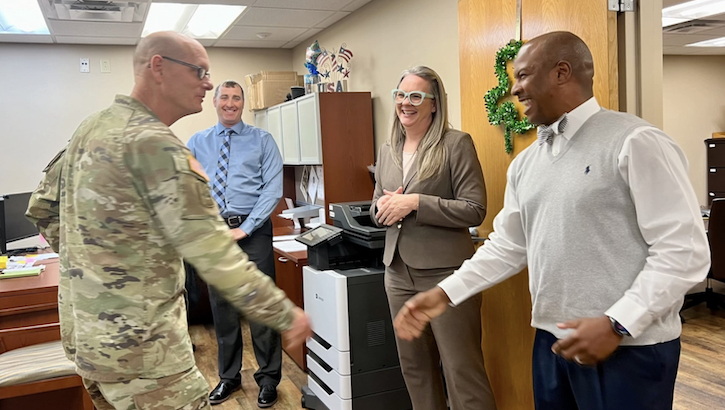 Members of the Human Resources Department at Lyster Army Health Clinic were all smiles during a recent visit by Brig. Gen. Lance Raney, Commanding General, Medical Readiness Command, East, and Director, Defense Health Network, East, on March 1. (Photo By Janice Erdlitz)