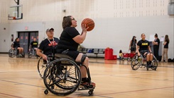 U.S. Army Cpt. Veronica, Jones shoots the ball during the U.S. Army Adaptive Sports Camp at Fort Bragg, North Carolina, on April 1. Over 70 wounded, ill and injured soldiers are training in a series of athletic events including archery, cycling, shooting, sitting volleyball, swimming, powerlifting, track, field, rowing, and wheelchair basketball. This year, the Warrior Games Challenge takes place in June 2023 at Naval Air Station North Island in San Diego, California. (Photo by U.S. Army Pvt. Theron Smith)