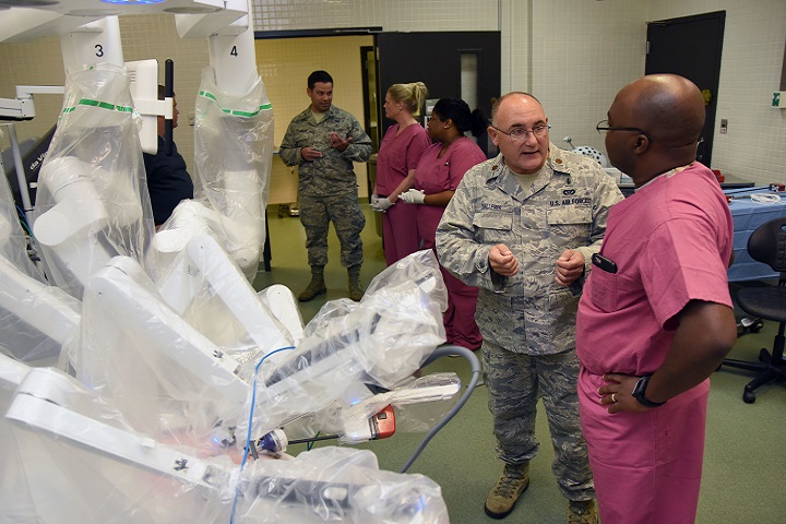 U.S. Air Force Maj. Scott Thallemer (foreground), 81st Surgical Operations Squadron Institute for Defense Robotic Surgical Education program coordinator, Keesler Air Force Base, Miss., and Air Force Maj. Joshua Tyler, InDoRSE program director, provide instruction to students during a robotics surgery training session at Keesler Air Force Base’s clinical research lab. (U.S. Air Fore photo by Kemberly Groue)