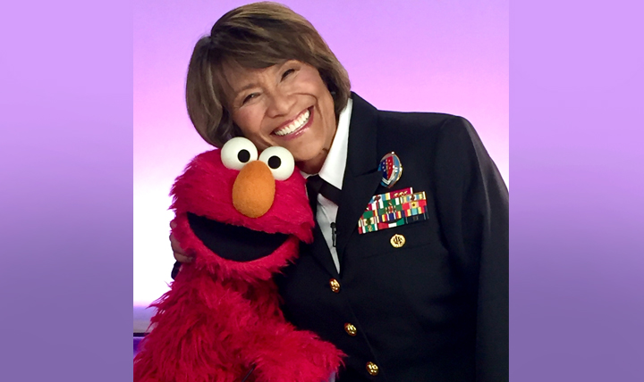 Defense Health Agency Director Vice Admiral Raquel “Rocky” Bono joined Sesame Street’s Elmo to record a welcome video for the new provider section of the Sesame Street for Military Families website. (Photo by MHS Communications)