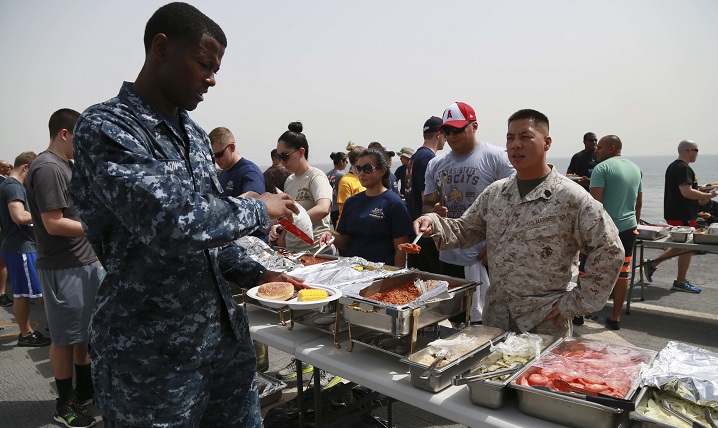 U.S. Marines and Sailors from the 15th Marine Expeditionary Unit and Essex Amphibious Ready Group fill their plates with food at a steel beach picnic aboard the amphibious transport dock ship USS Anchorage. Solid fats, or SoFAS, are solid at room temperature and are found in foods such as butter, cheese, meats and foods made with these products, such as pizza, burgers and fried foods. Foods containing SoFAS are often high in calories but don’t provide important nutrients such as vitamins, minerals or fiber. (U.S. Marine Corps photo by Sgt. Steve H. Lopez)