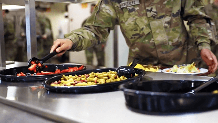 Military personnel getting food 