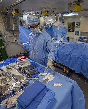 Navy Cmdr. Jeffrey Chao, the Littoral Combat Group One, surgeon, performs an emergency appendectomy aboard the San Antonio-class amphibious transport dock ship USS Somerset. (U.S. Navy photo by Mass Communication Specialist 1st Class Andrew Brame)