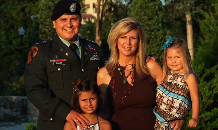 Then-Army Maj. Ed Pulido, stands with his wife, Karen, and daughters, Kaitlin and Kinsley in June 2010. Pulido retired from the Army and is 12 years into his recovery and credits his family for encouraging and supporting him during that time. 