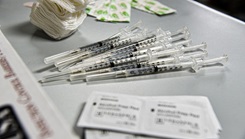 Prepared COVID-19 vaccine shots wait to be administered to an Airman. Members of the 134th Air Refueling Wing were eligible to receive their COVID-19 vaccines during Unit Training Assembly here May 2nd, 2021.