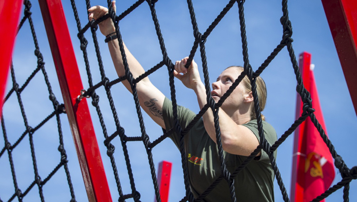 Image of a Marine climbing a rope ladder