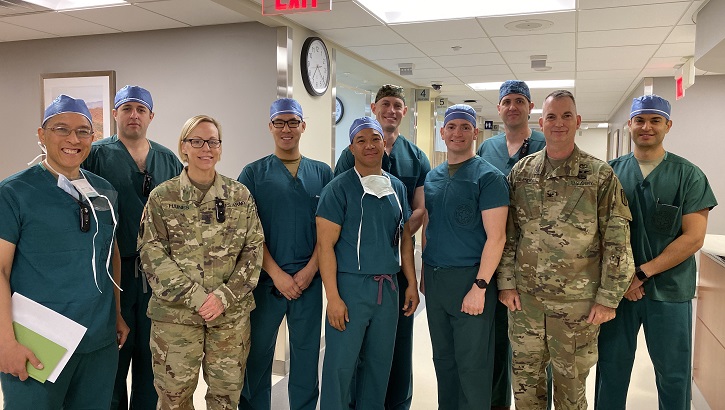 The Army, Navy and Air Force surgeons and physician assistant met with the hospital command team. (Left to right) Army Col. Alfonso Alarcon, orthopedic surgeon at BDAACH; Army Maj. Harry Aubin, general surgeon at BDAACH; Army Command Sgt. Maj. Nicole Haines, the hospital senior enlisted advisor; Air Force Capt. Christopher Ng, Air Force general surgeon with 51st MDG; Army Maj. Eric de la Cruz, chief of general surgery at BDAACH; Navy Lt. Cmdr. Paul Lewis and Lt. Cmdr. Dan Sanford, general surgeons with 3rd Medical Battalion; Army Maj. John Fletcher, general surgeon at BDAACH; Army Col. Andrew L. Landers, hospital commander, and Air Force Capt. Steven Maya, physician assistant with 51st MDG. (U.S. Army photo by Inkyeong Yun)