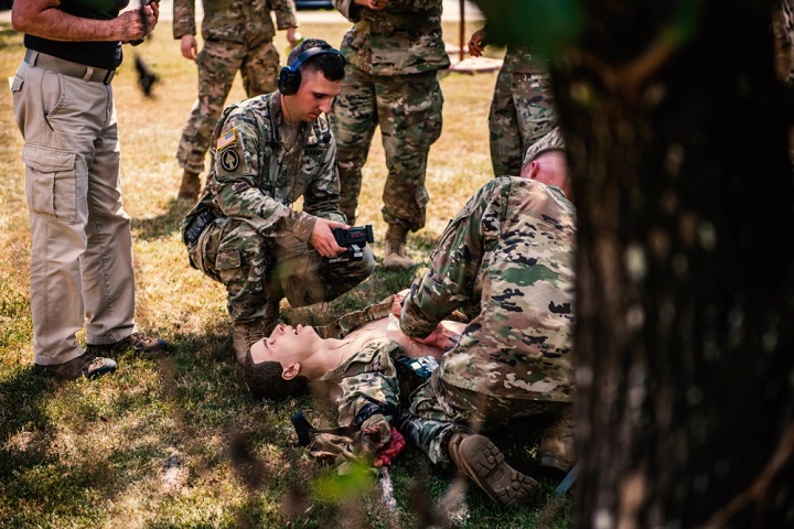 Soldiers at Fort Benning, Georgia, train one another on using the Tactical Combat Casualty Care Exportable system, a medical trauma training mannequin. Personnel from the office of the Program Executive Officer for Simulation, Training and Instrumentation, brought new, technologically advanced medical training mannequins to Fort Benning to increase the realism of medical trauma training and ultimately to save lives and limbs. (U.S. Army photo by Patrick Albright)