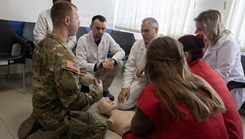 Florida Army National Sgt. Benford Rosenfeldt, a combat medic and platoon sergeant assigned to Kosovo Force (KFOR) Regional Command-East’s Task Force Medical, leads hands‑on lifesaving training for local health clinic providers