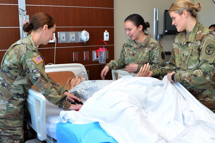 Army OB/GYN nurse residents train in the CRDAMC simulation lab. The OB/GYN Nurse Resident Program, only offered at CRDAMC, focuses on OB/GYN nursing skills that include childbearing, high-risk and complicated pregnancy, newborn assessment and care and family planning gynecology. (U.S. Army photo by Gloria Montgomery)