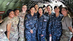 Royal Thai Air Force nurses pose with U.S. Air Force personnel aboard a Lockheed C-5 Galaxy at Joint Base San Antonio-Lackland, Texas, on Sept. 9, 2024. The visit, part of a collaborative exchange program with the 59th Medical Wing, allowed Thai nurses to experience U.S. military health care operations and readiness training firsthand. (U.S. Air Force photo by Senior Airman Matthew-John Braman)