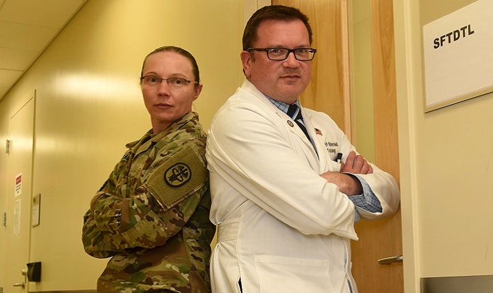 U.S. Army Maj. Lynn Wagner, Armed Forces Medical Examiner System Division of Forensic Toxicology Special Forensic Toxicology Drug Testing Facility chief (left), and Dr. Jeffrey Walterscheid, AFMES Division of Forensic Toxicology chief toxicologist, pose for a photo. Wagner and Walterscheid want to let service members know they are watching and making sure they do not get away with doing synthetic cannabinoids. (U.S. Air Force photo by Senior Airman Ashlin Federick)