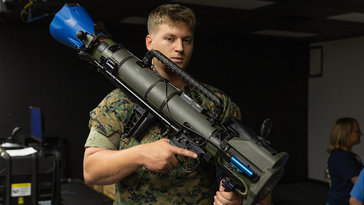 Marine holds weapon