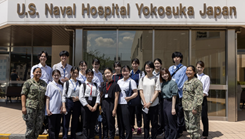 U.S. Navy Medicine Readiness and Training Command Yokosuka pose for a group photo outside of the facility