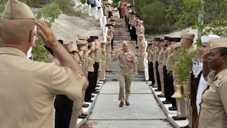 Capt. Richard Zeber salutes military personnel