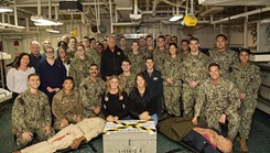 U.S. sailors, soldiers, and educators take an portrait after dental officer triage training aboard the USS Iwo Jima, Oct. 17, 2024. Over the course of three days, U.S. Army and U.S. Navy dental officers from Iwo Jima, Navy Medicine Readiness and Training Command Portsmouth, and Fort Lee Dental Clinic Command conducted mass casualty, tactical combat casualty care, and triage training. (U.S. Navy photo by Mass Communication Specialist 2nd Class Levi Decker)