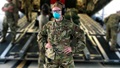 U.S. Navy Major (Dr.) Courtney Beaver wearing surgical mask