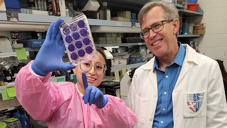 Dr. Brian Schaefer, a professor in USU’s Department of Microbiology and Immunology, and Celeste Huaman, a PhD  candidate at USU, led a study that found a potential cure for rabies. (Photo by Sarah Marshall, USU) 