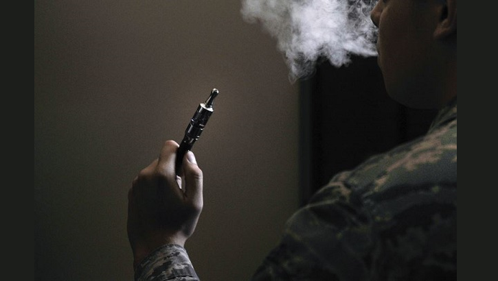 An Airman holds an electronic cigarette at Scott Air Force Base, Illinois. The Centers for Disease Control and Prevention is investigating the more than 2,000 cases of e-cigarette, or vaping, product use associated lung injury that have occurred across the country. (U.S. Air Force photo by Airman 1st Class Erica Crossen)