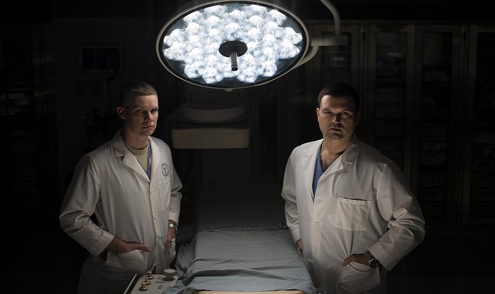 Air Force Lt. Col. Jason Compton (left) and Air Force Maj. Chales Chesnut, 99th Medical Group general surgeons, pose for a portrait in the Mike O’Callaghan Military Medical Center at Nellis Air Force Base, Nevada. The surgeons were two members of the team that took in trauma patients at the University Medical Center of Southern Nevada during the Las Vegas shooting Oct. 1, 2017. (U.S. Air Force photo by Senior Airman Kevin Tanenbaum)