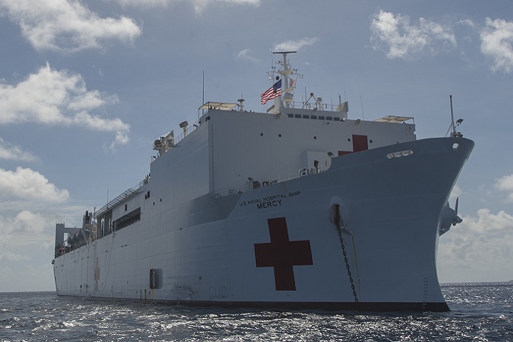 The hospital ship USNS Mercy anchors in shallow water during a Pacific Partnership stop. (PP18). PP18’s mission is to work collectively with host and partner nations to enhance regional interoperability and disaster response capabilities, increase stability and security in the region, and foster new and enduring friendships across the Indo-Pacific Region. (U.S. Navy photo by Mass Communication Specialist 3rd Class Cameron Pinske) 