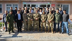 Military personnel posing for a picture