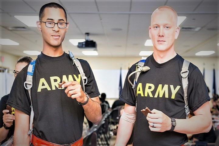 Two U.S. Army soldiers eat a version of the Performance Readiness Bar. USARIEM researchers will monitor them to test whether the bar affects bone density. (U.S. Army photo by Mr. David Kamm)