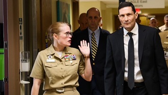 Link to Photo: ere, Darin Selnick (right), the leader performing the duties of the Under Secretary of Defense for Personnel and Readiness, and Dr. Steve Ferrara (center), the Acting Assistant Secretary of Defense for Health Affairs, listen to the director of Walter Reed, U.S. Navy Capt. Melissa Austin (left), provide an update on the situation. 