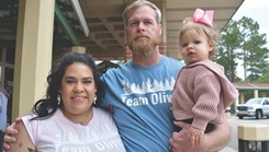 Jennifer Hartman, left, joins husband Jason and daughter Olivia in remembering the Hartman’s son, Oliver. The Walk to Remember has been a Womack tradition for almost two decades. The event allows parents who have lost children to meet at the same place, share their experiences and take time out to remember their loved ones. (Photo By Dan Grubb)