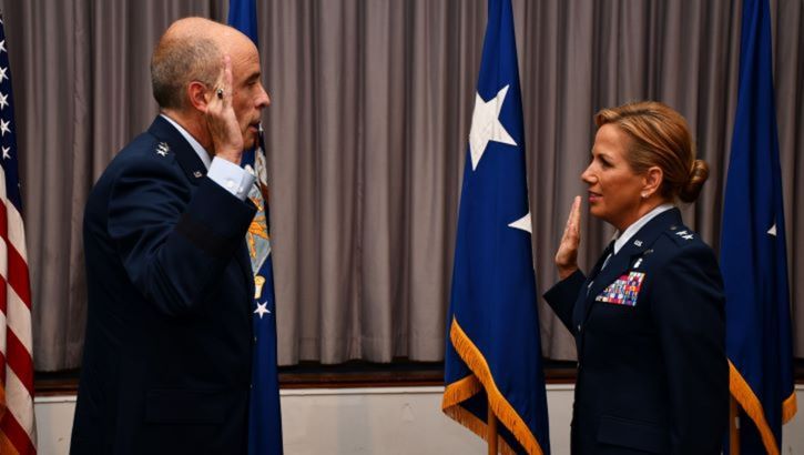 Image of Military personnel receiving a promotion. Click to open a larger version of the image.
