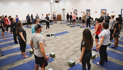 Military personnel doing yoga