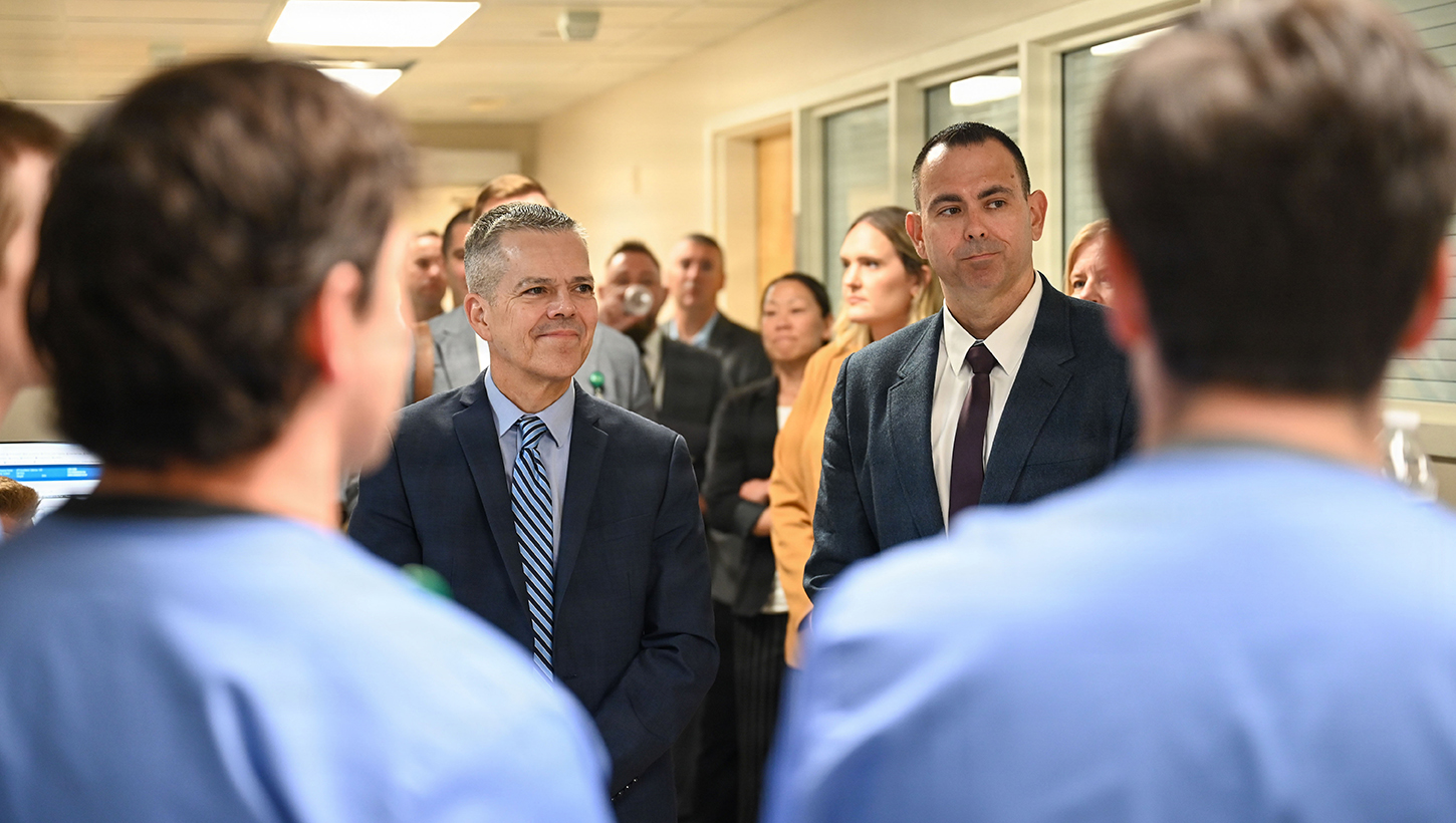 U.S. Air Force Lt. Gen. John J. DeGoes, left, Air Force Medical Command commander, and Chief Master Sgt. James M. Woods, right, AFMEDCOM senior enlisted leader, learn about Air Force Special Operations Command Airmen receiving advanced training