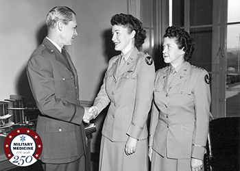 Air Force Gen. Hoyt S. Vandenberg, chief of staff, U.S. Air Force, congratulates chief of the Air Force Nurse Corps, Air Force Col. Verena Zeller (center), and chief of the Air Force Women’s Medical Specialists Corps, Air Force Lt. Col. Miriam Perry (right), upon their promotion.
