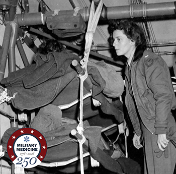 Air Force Lt. Suella Bernard tends to patients in one of the two CG-4A gliders before the C-47s arrived.