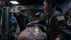 Air Force Senior Airman Joresa May Nolido, right, 86th Aeromedical Evacuation Squadron technician, performs patient care during a medical simulation