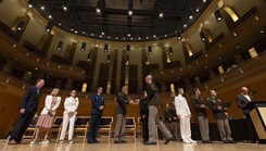 A U.S. Army medical officer shakes hands with the official party during the 2025 National Capital Consortium Graduation Ceremony 