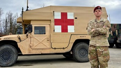 Army Sgt. Zachariah Clark, a combat medic assigned to the 11th Airborne Division, poses for a photo 