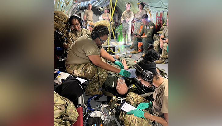 military medical personnel provide emergency care during simulated training