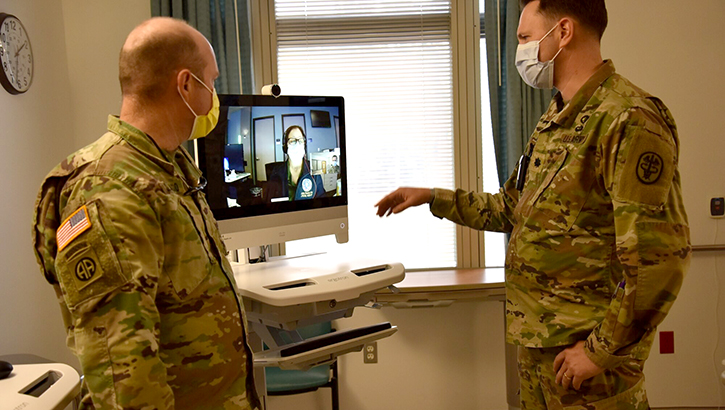 Military medical personnel demonstrating new tele-critical care medicine