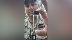Lt. Randy Buckley, assigned to Navy Environmental Preventive Medicine Unit TWO (NEPMU-2), displays a mosquito specimen collected during field surveillance operations at Camp Turtle
