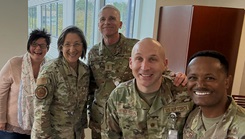 Cristina Simmers, medical standards program manager for the U.S. Space Force Medical Operations Directorate, poses with U.S. Space Force Col. Lidia Ilcus, U.S. Air Force Maj. Gen. Sean Collins, U.S. Air Force Maj. Cory Henderson, and U.S. Air Force Tech. Sgt. Getahun Mhiretie during a team meeting