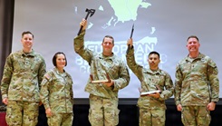 (Pictured from left to right are; Col. Jeremy Johnson, Chief of Staff for Medical Readiness Command, Europe, Command Sgt. Maj. Kalani Kalili, Command Sergeant Major for Medical Readiness Command, Europe, Capt. David Winter (Team Charlie), Staff Sgt. Andrew Robles (Team Charlie) and Command Sgt. Maj. Christopher Carbone, Command Sergeant Major for Installation Management Command – Europe
